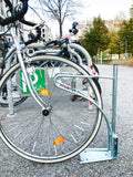 CLEDO - support pour trottinettes et vélos avec un nombre de places de stationnement verrouillables au choix  pour les trottinettes électriques, les trottinettes à pédales et les vélos.